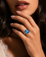 Starburst-cut topaz statement ring with open gallery and pavé shoulders in 18K yellow gold | SARATTI