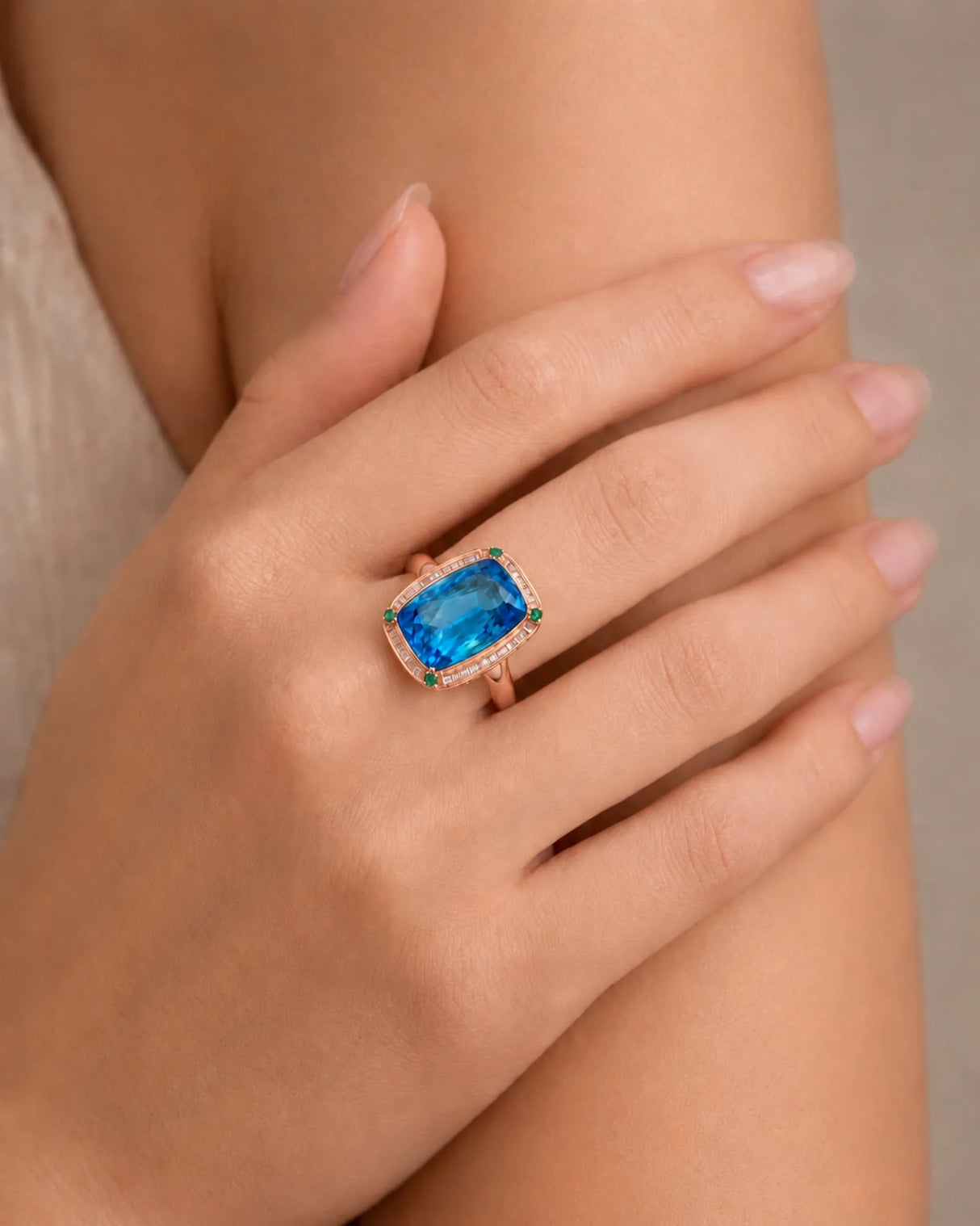 Statement blue topaz cocktail ring with green accents for milestone celebrations in 18K rose gold | SARATTI
