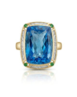 Statement blue topaz cocktail ring with green accents for milestone celebrations in 18K yellow gold | SARATTI