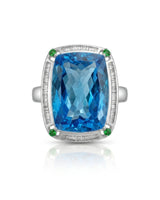 Statement blue topaz cocktail ring with green accents for milestone celebrations in platinum | SARATTI