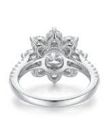 Statement floral moissanite engagement ring with pavé shoulders crafted in polished platinum | SARATTI