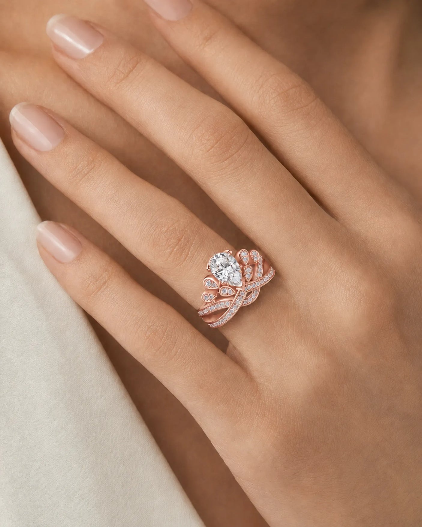 Statement pear moissanite proposal ring with ornate crown setting and pavé 18K rose gold band | SARATTI