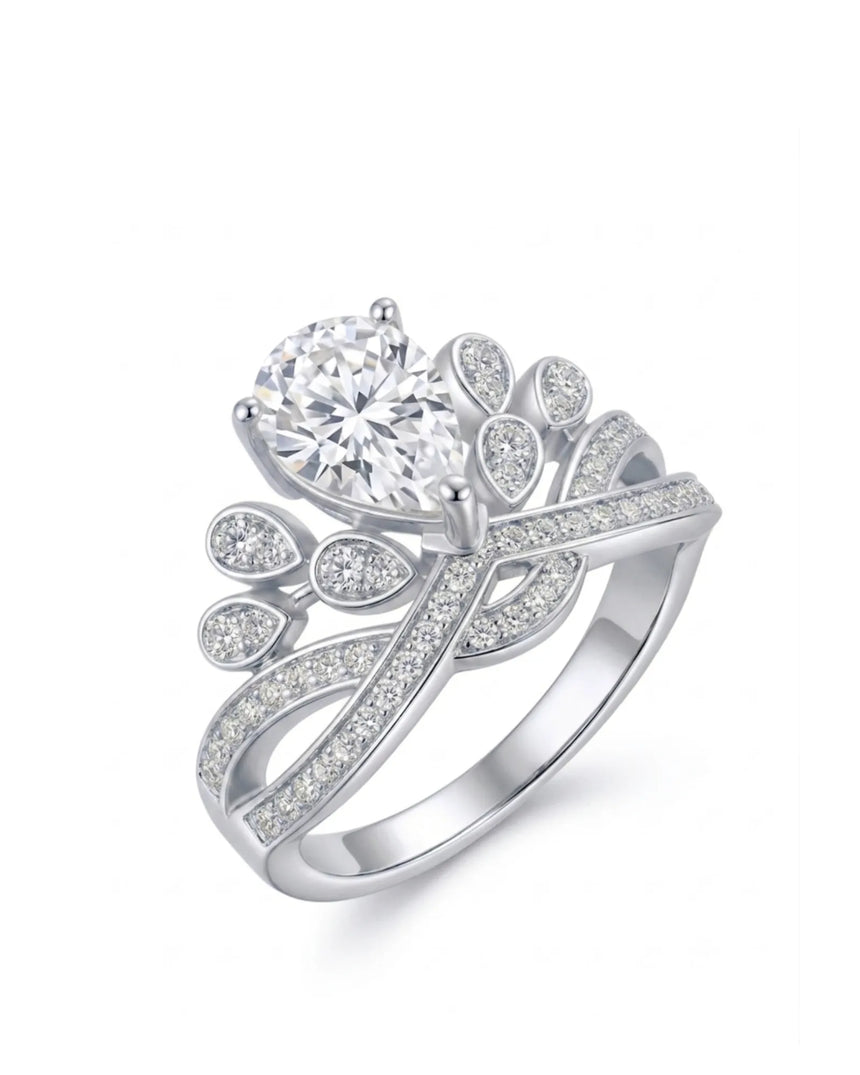Statement pear moissanite proposal ring with ornate crown setting and pavé platinum band | SARATTI