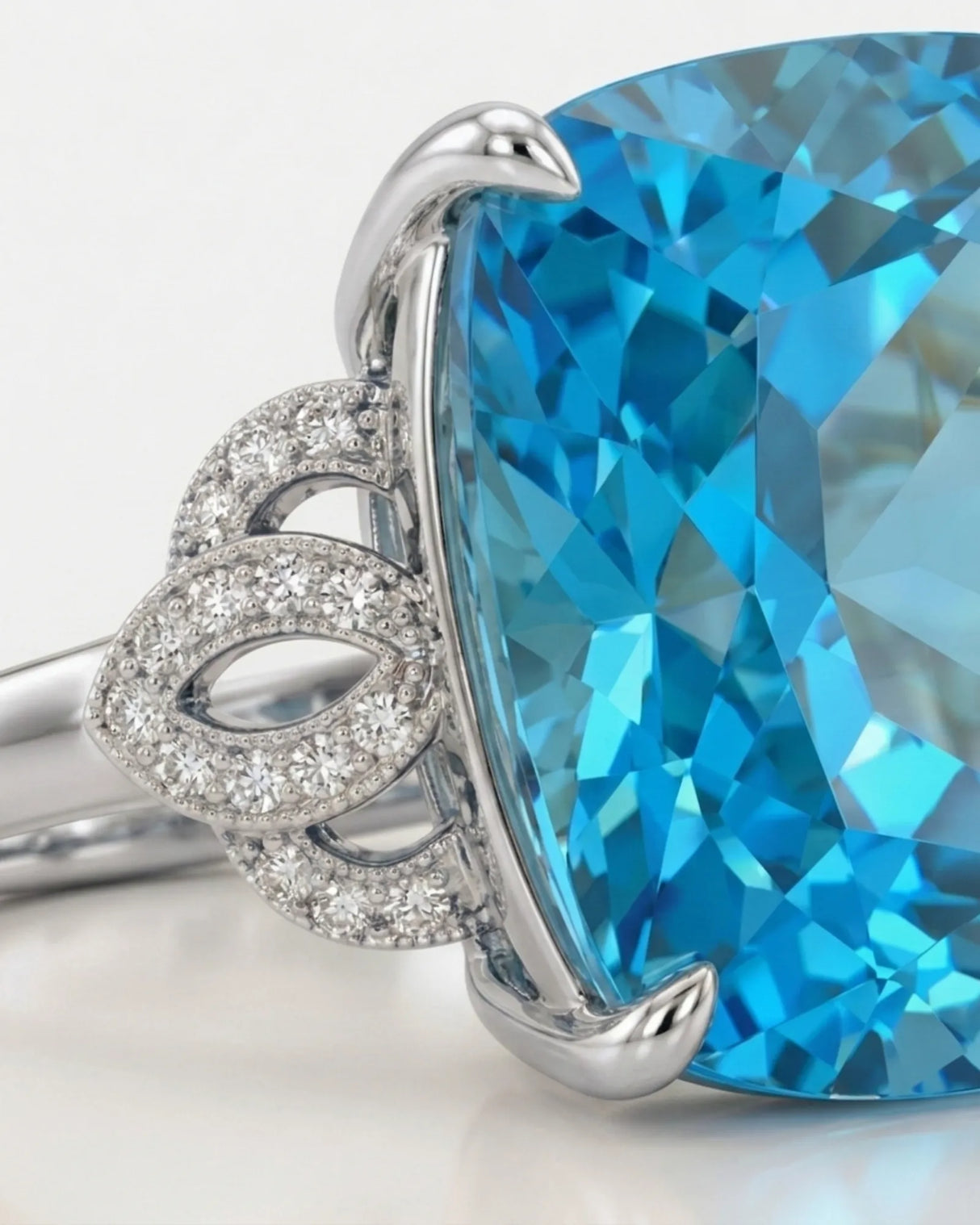 Swiss Blue cushion topaz and diamond statement ring with openwork shoulders in polished platinum | SARATTI