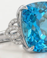 Swiss Blue cushion topaz and diamond statement ring with openwork shoulders in polished platinum | SARATTI