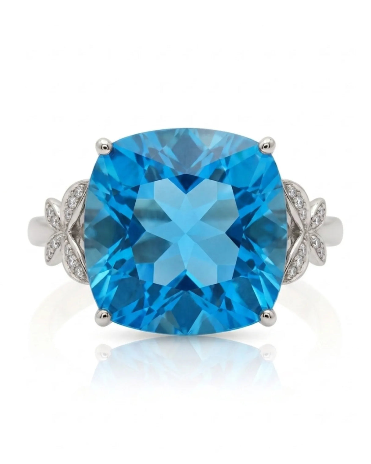 Swiss Blue cushion topaz ring with vivid color and round diamonds in platinum | SARATTI