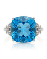 Swiss Blue cushion topaz ring with vivid color and round diamonds in platinum | SARATTI