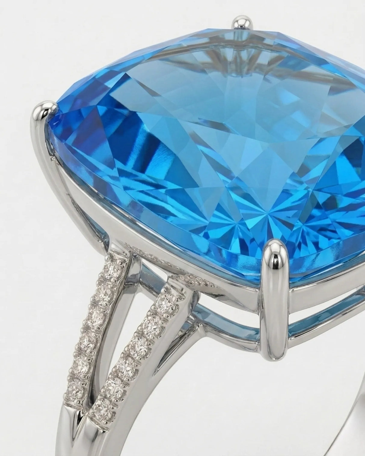Swiss Blue topaz and diamond engagement ring with sculpted split shank in 18K white gold | SARATTI