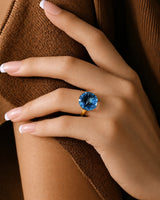 Swiss Blue topaz anniversary ring with pavé diamonds and sculpted shoulders in 18K yellow gold | SARATTI