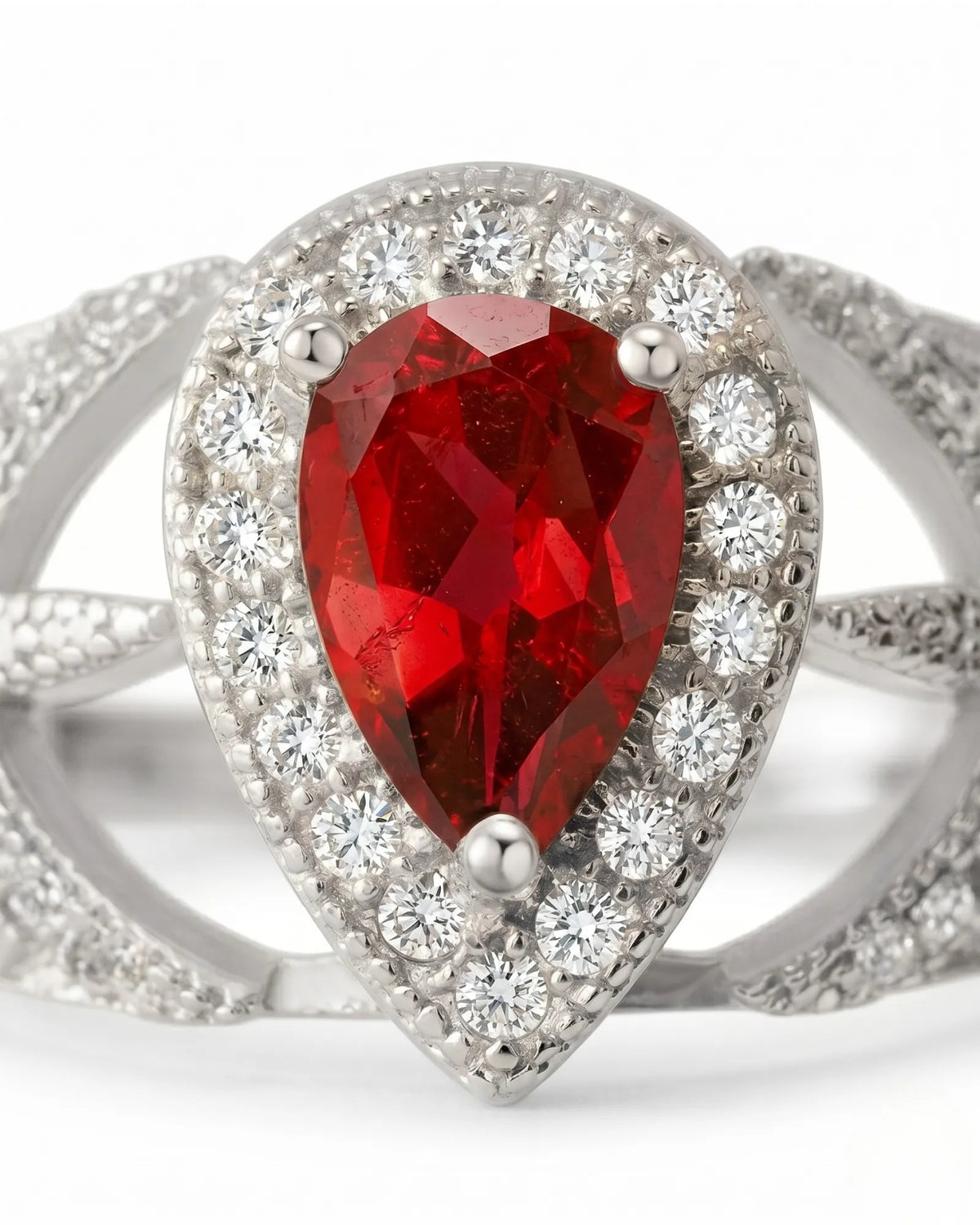 Teardrop ruby ring with pavé diamond openwork design in platinum setting | SARATTI
