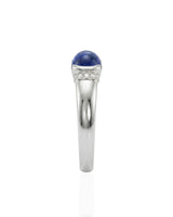 Tension set sapphire ring with modern ribbed band design in 18K white gold | SARATTI