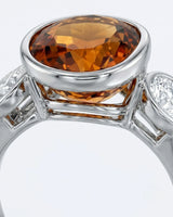 Three-stone composition gives the design symmetry and presence in white gold | SARATTI
