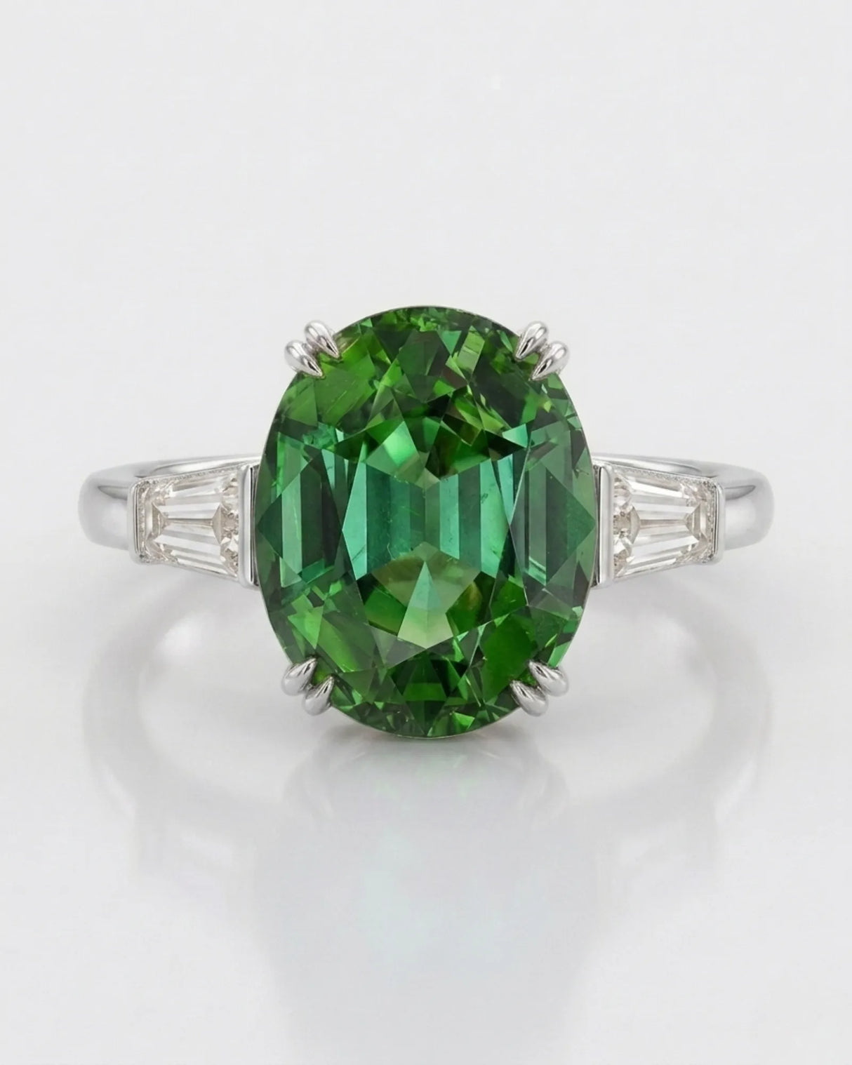 Three-stone green tourmaline ring with clean diamond accents and white gold setting | SARATTI