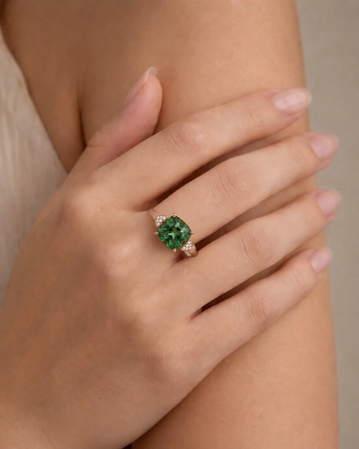 Three-stone green tourmaline ring with diamond heart pavilions and 18K rose gold setting | SARATTI