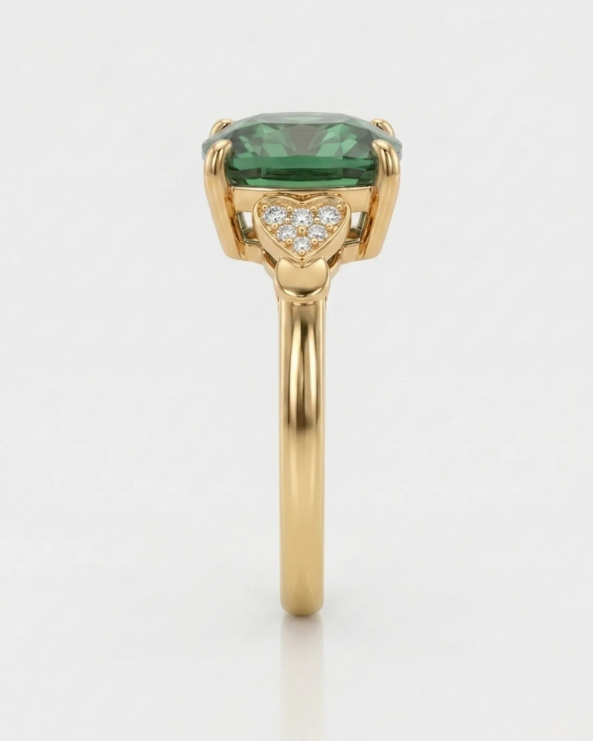 Three-stone green tourmaline ring with diamond heart pavilions and 18K yellow gold setting | SARATTI