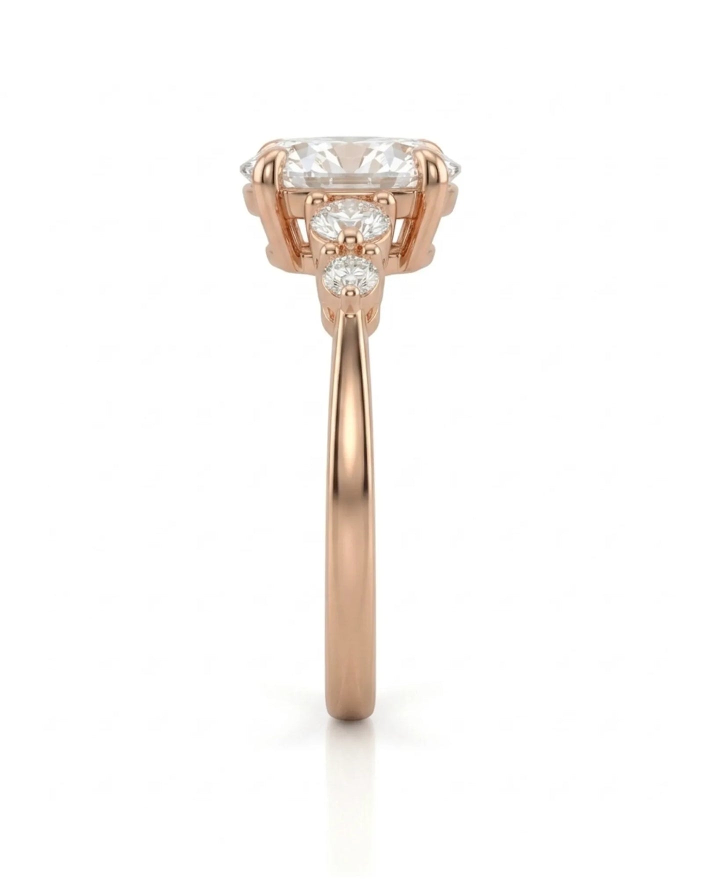 Three-stone oval diamond engagement ring in 18K rose gold for a romantic proposal moment | SARATTI