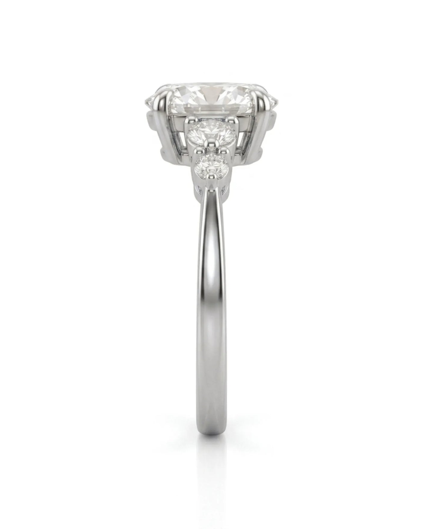Three-stone oval diamond engagement ring in 18K white gold for an elegant proposal moment | SARATTI