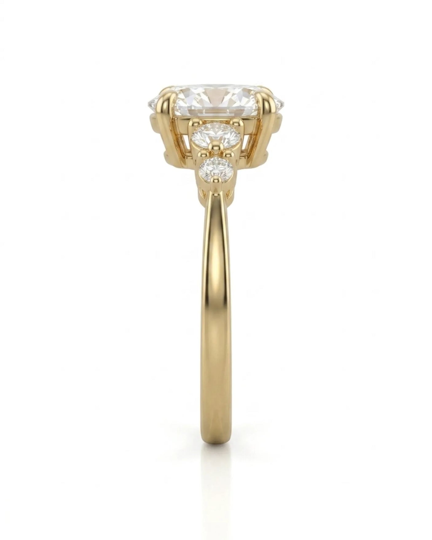 Three-stone oval diamond engagement ring in 18K yellow gold for a refined proposal moment | SARATTI