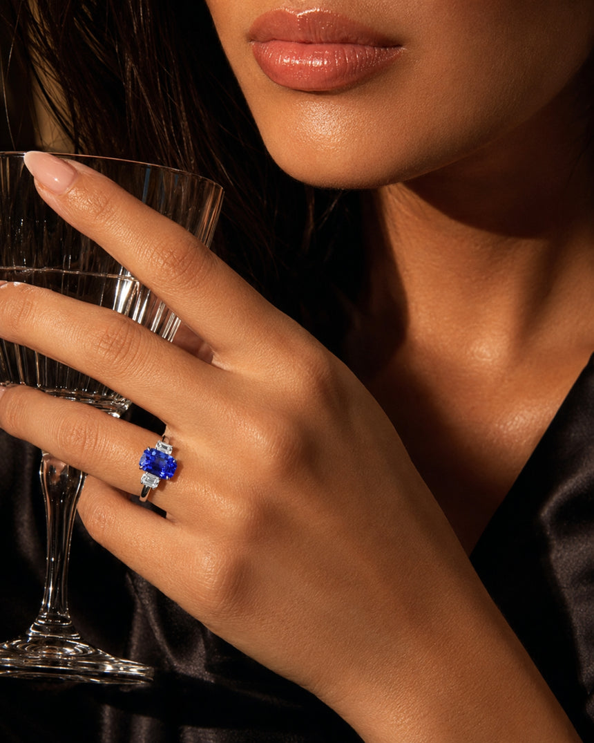 Three-stone sapphire ring with step-cut diamonds and architectural 18K white gold setting | SARATTI