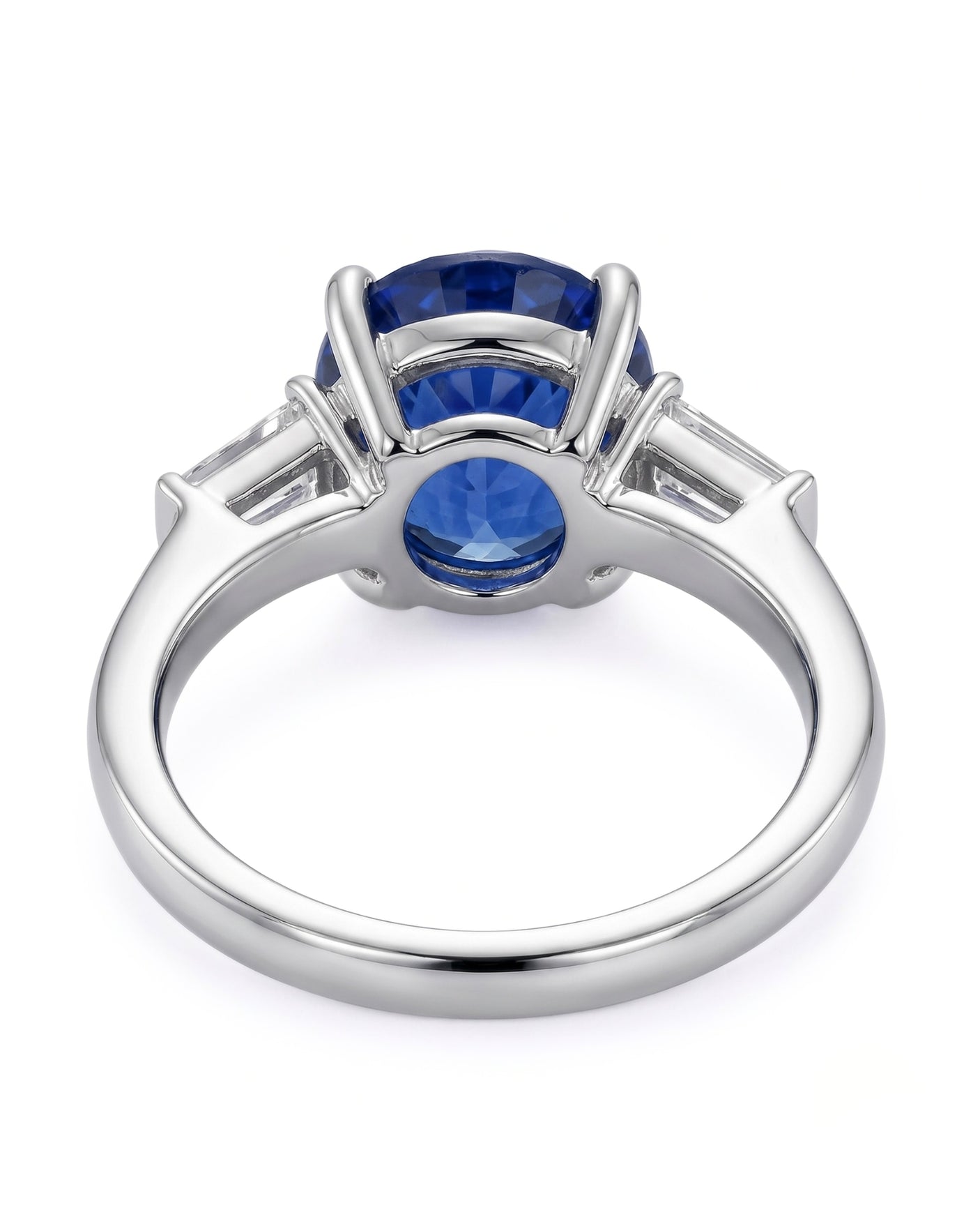 Three-stone sapphire ring with tapered baguette diamonds and refined platinum setting | SARATTI