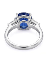 Three-stone sapphire ring with tapered baguette diamonds and refined platinum setting | SARATTI