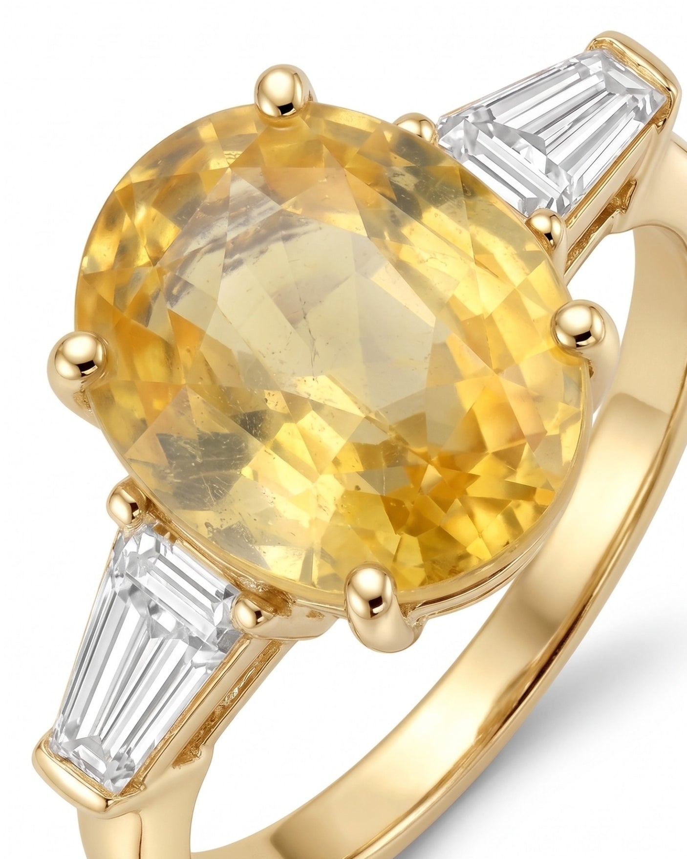 Three-stone yellow sapphire ring with tapered diamond side stones in 18K yellow gold | SARATTI