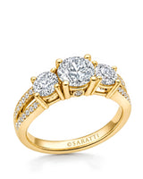 Three round moissanite stones create a luminous engagement ring in polished 18K yellow gold | SARATTI
