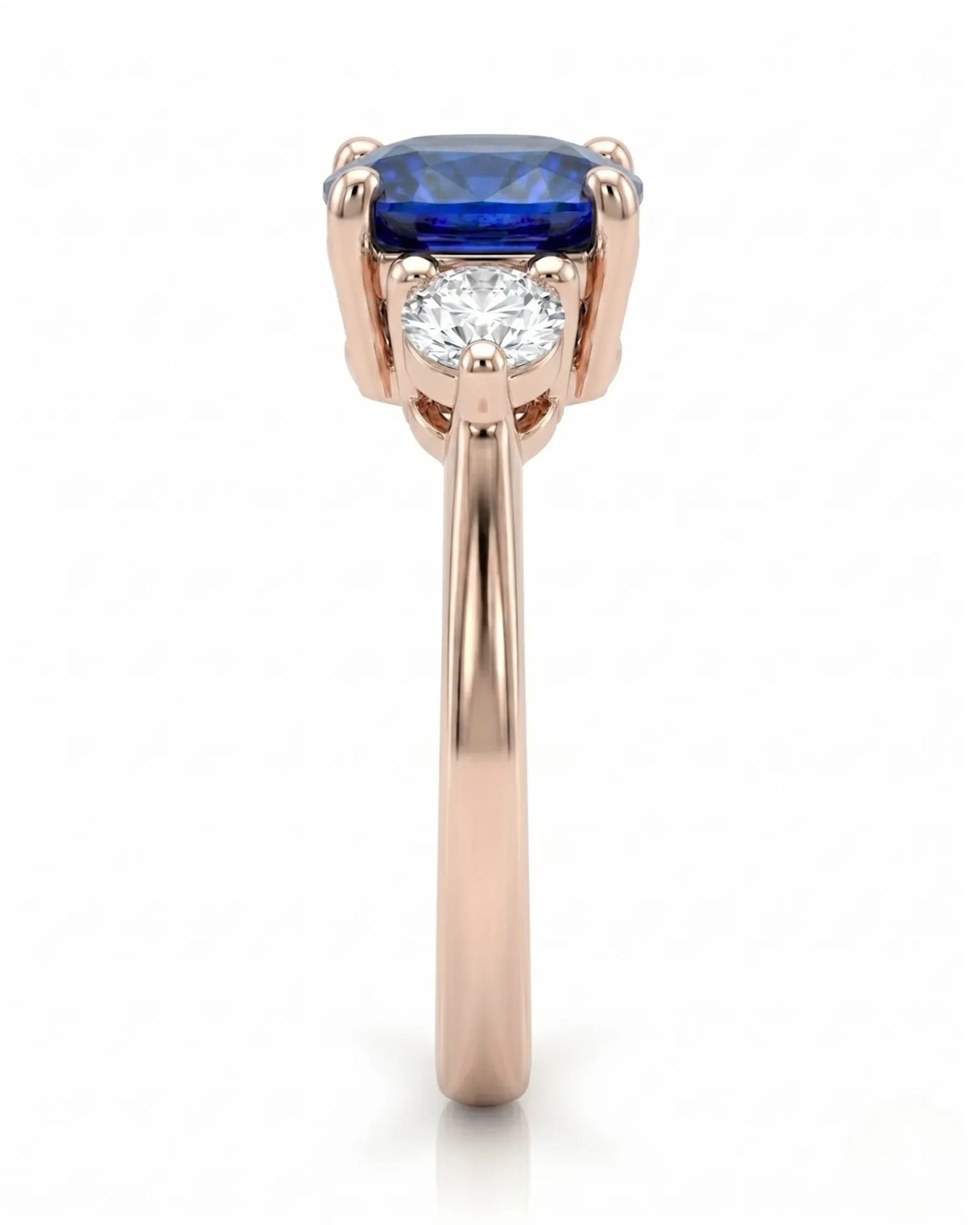 Three stone sapphire ring with round diamond accents in romantic rose gold | SARATTI