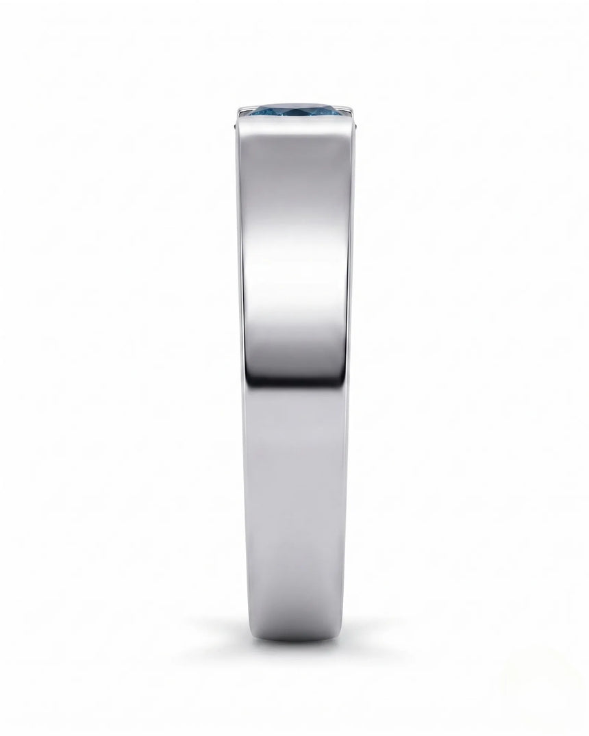 Treated blue diamond men’s wedding band worn on hand in polished 18K white gold | SARATTI