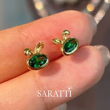 Model holds the Tsavorite Bunny Stud Earrings | Saratti Fine Jewelry 