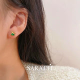 Model wears the Tsavorite Bunny Stud Earrings | Saratti 