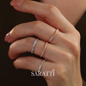 Close up shot of Model's Hand with the Twisted Shank Diamond Eternity Wedding Bands in White and Rose Gold | Saratti 