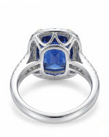 Two-tone sapphire ring with yellow gold prongs and diamond halo in 18K white gold -- SARATTI.