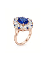 Unheated blue sapphire cocktail ring with diamond floral halo in 18K rose gold | SARATTI