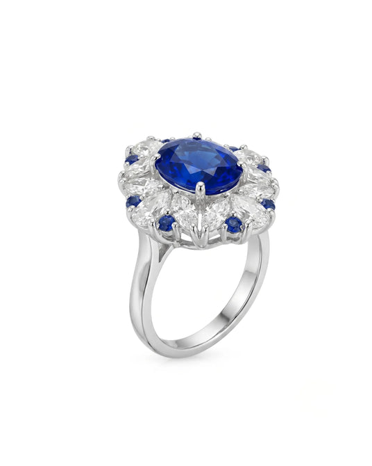 Unheated blue sapphire cocktail ring with diamond floral halo in 18K white gold | SARATTI