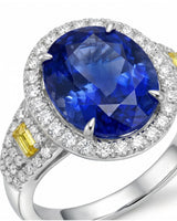 Unheated oval blue sapphire ring with colorless diamonds and yellow diamonds in 18K white gold | SARATTI