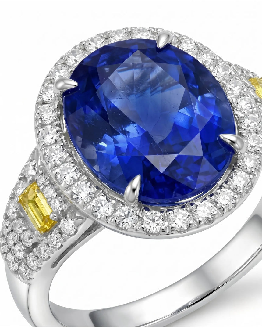 Unheated oval blue sapphire ring with colorless diamonds and yellow diamonds in 18K white gold | SARATTI