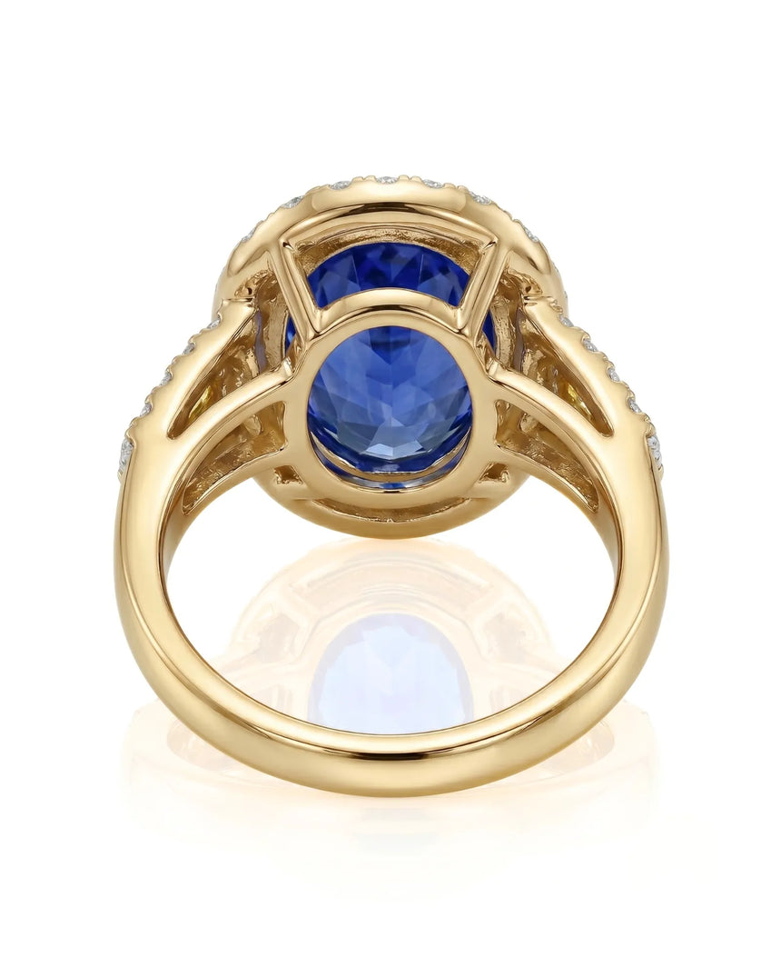 Unheated oval blue sapphire ring with colorless diamonds and yellow diamonds in 18K yellow gold - SARATTI