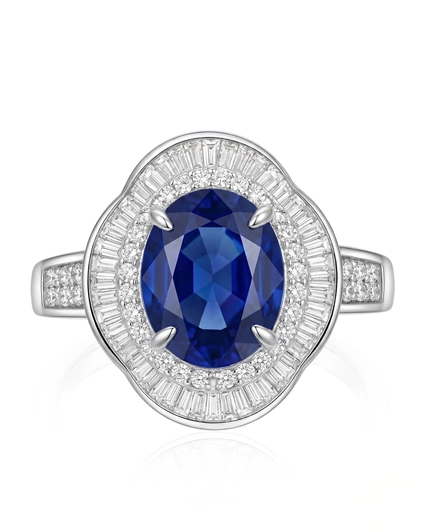 Unheated oval sapphire ring with tapered baguette diamonds and royal blue center in 18K white gold | SARATTI