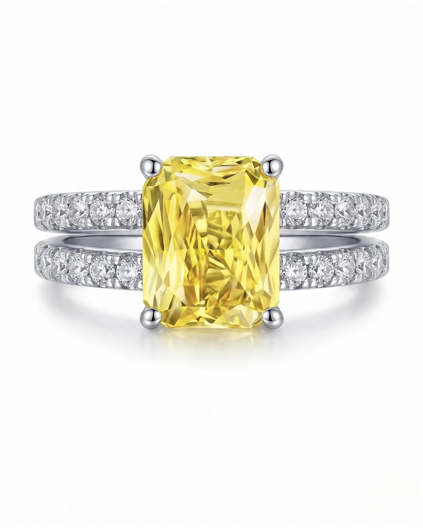 Unheated radiant yellow sapphire ring framed by diamond bands in 18K white gold | SARATTI