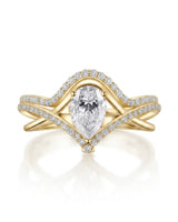 V-shaped pear moissanite engagement ring with open split shank and curved yellow gold wedding band | SARATTI