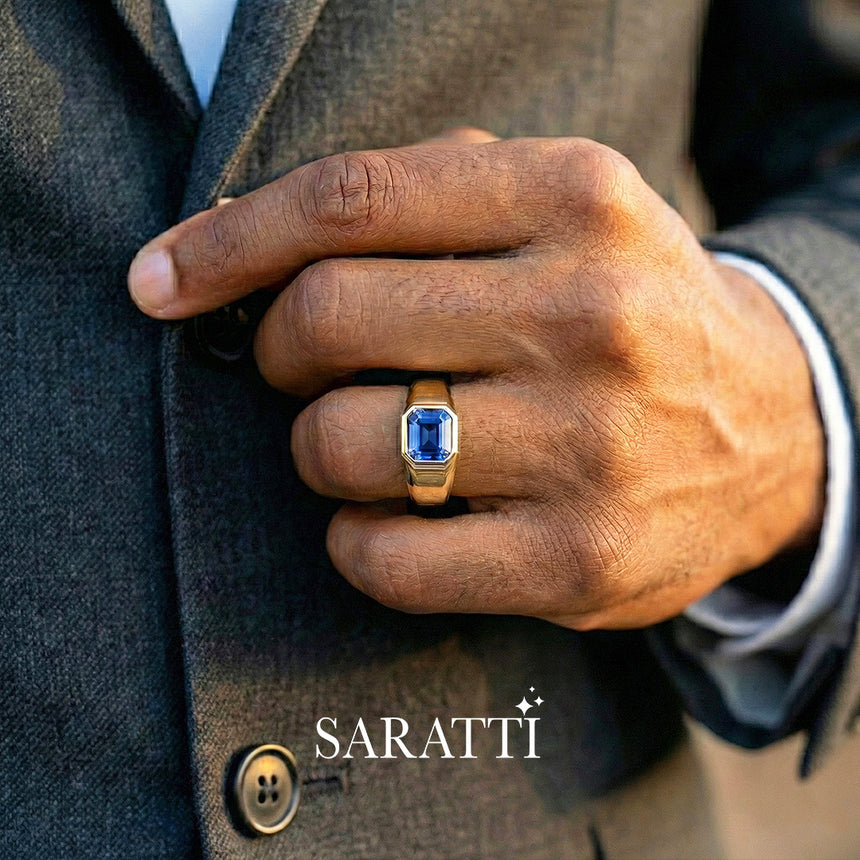 Mens sapphire wedding band blue sapphire center stone detail in 18K yellow gold | SARATTI