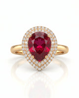 Vibrant red-pink pear tourmaline ring framed by diamonds in 18K yellow gold | SARATTI