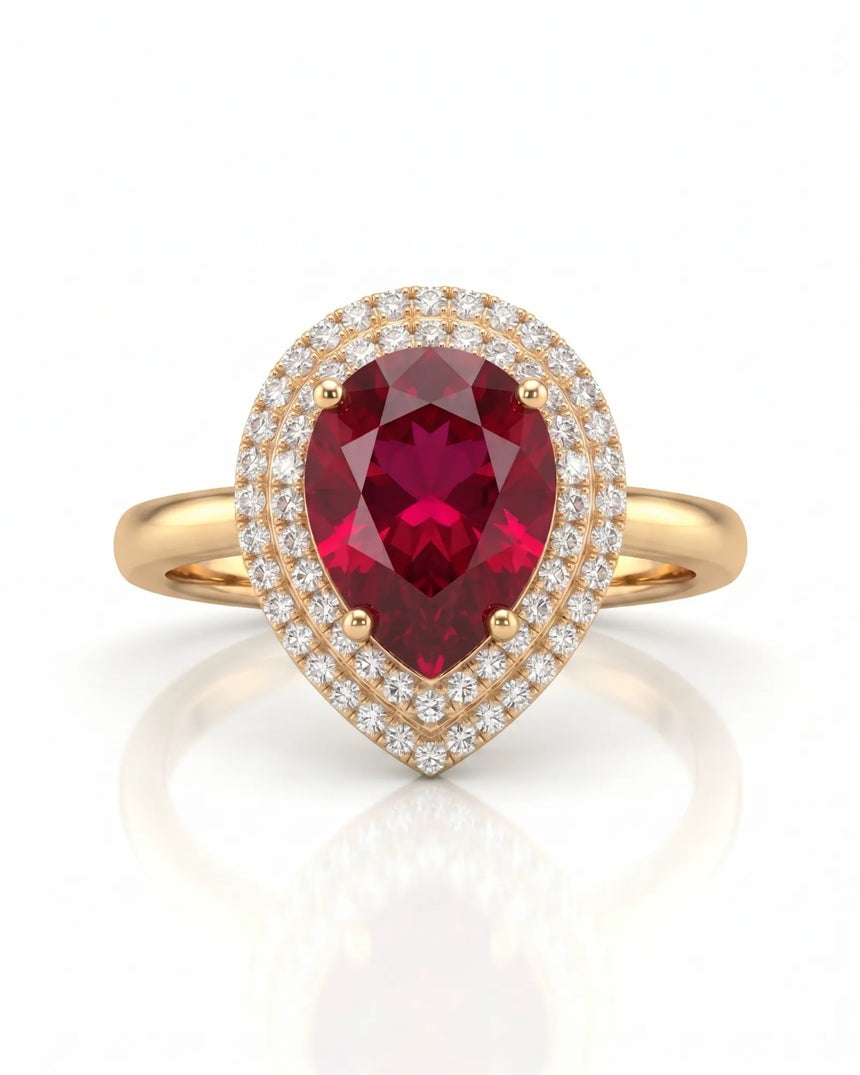 Vibrant red-pink pear tourmaline ring framed by diamonds in 18K yellow gold | SARATTI