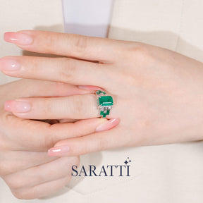Model fingers the Héritage Picasso Emerald & Diamond Ring | Saratti