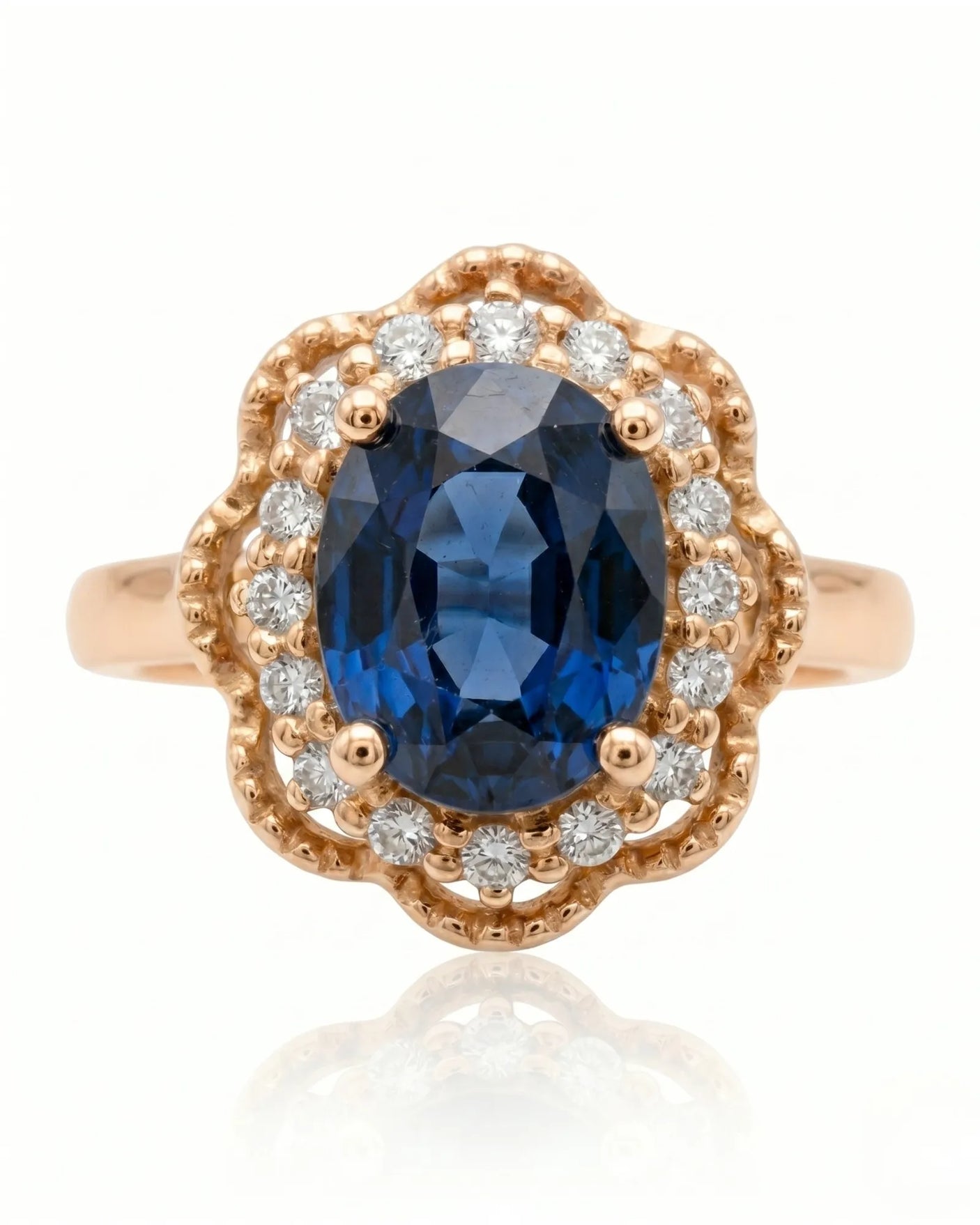 Vintage-inspired sapphire ring with floral diamond halo in romantic rose gold | SARATTI