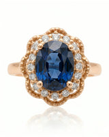 Vintage-inspired sapphire ring with floral diamond halo in romantic rose gold | SARATTI