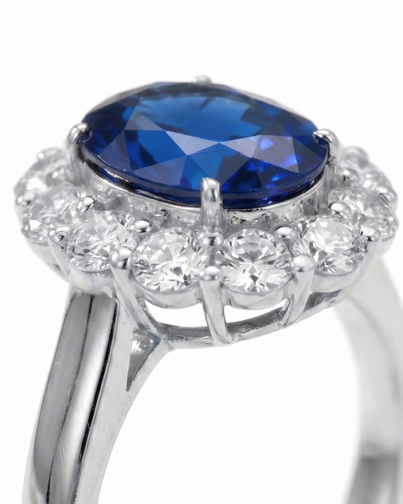 Vintage halo sapphire ring with classic diamond accents in enduring platinum | SARATTI