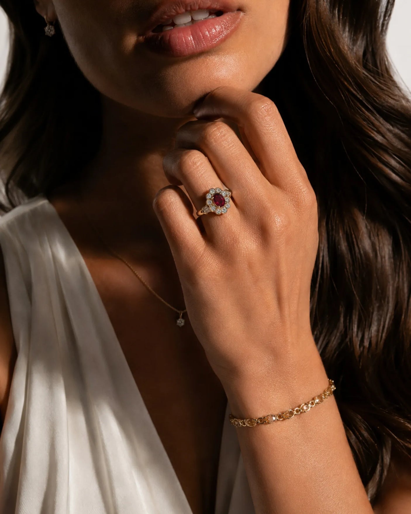 Vintage inspired ruby ring with round diamond halo in polished yellow gold | SARATTI