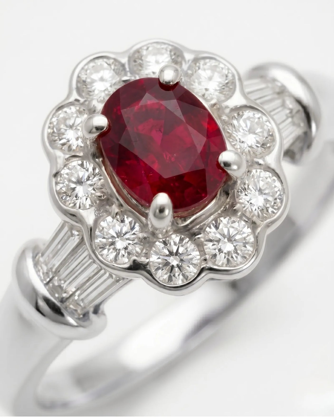 Vintage inspired ruby ring with round diamond halo in refined platinum | SARATTI